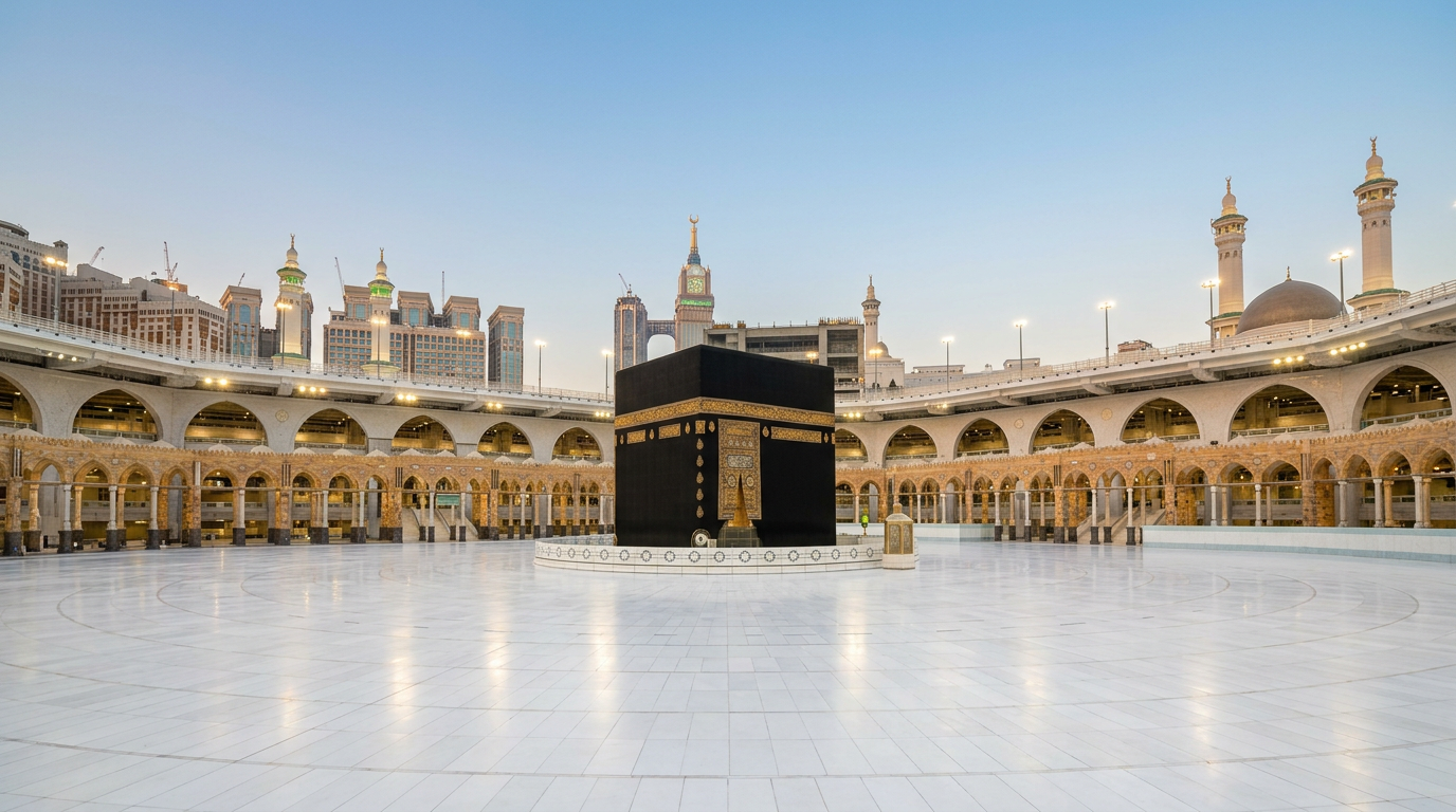 Kaaba in the center of the empty Grand Mosque courtyard surrounded by arches and minarets